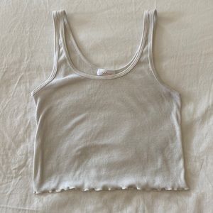 Simple white cropped tank with ruffles bottom